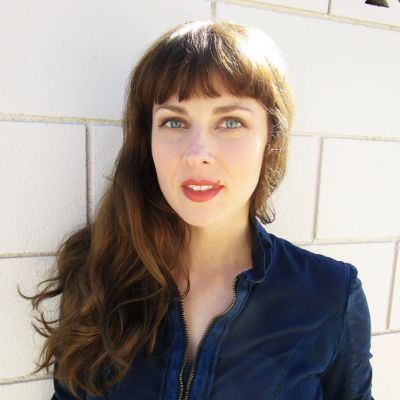  Anna Geisslinger's sister, Nell Geisslinger posing for a photo shoot. Image Source: IMDb